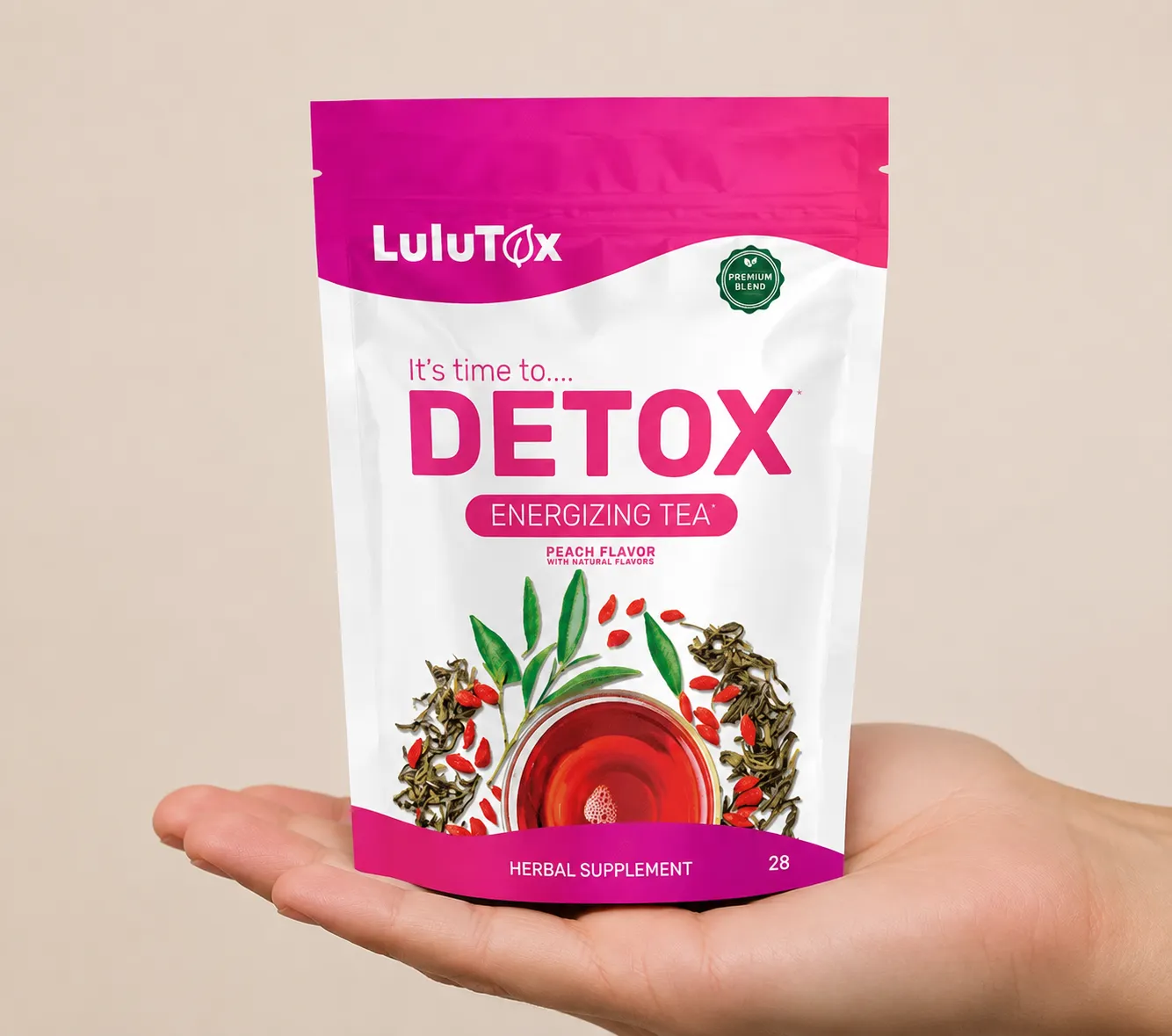 Lulutox Detox Tea HCTC — the package held in a hand